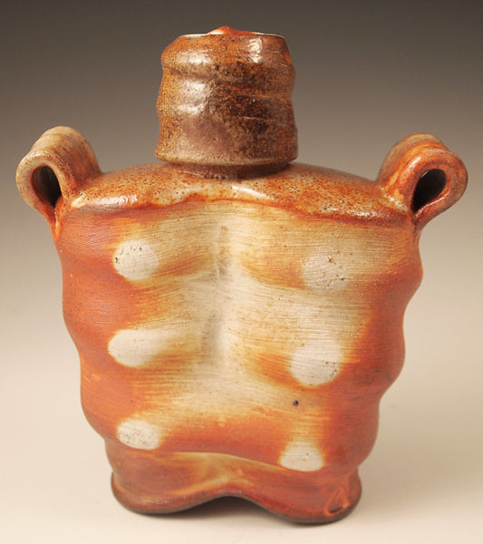 Wood-fired stoneware whiskey flask with liner glaze. Handmade Pottery.  Unique design, yet functional. 7" tall. 6" wide.  3" deep.